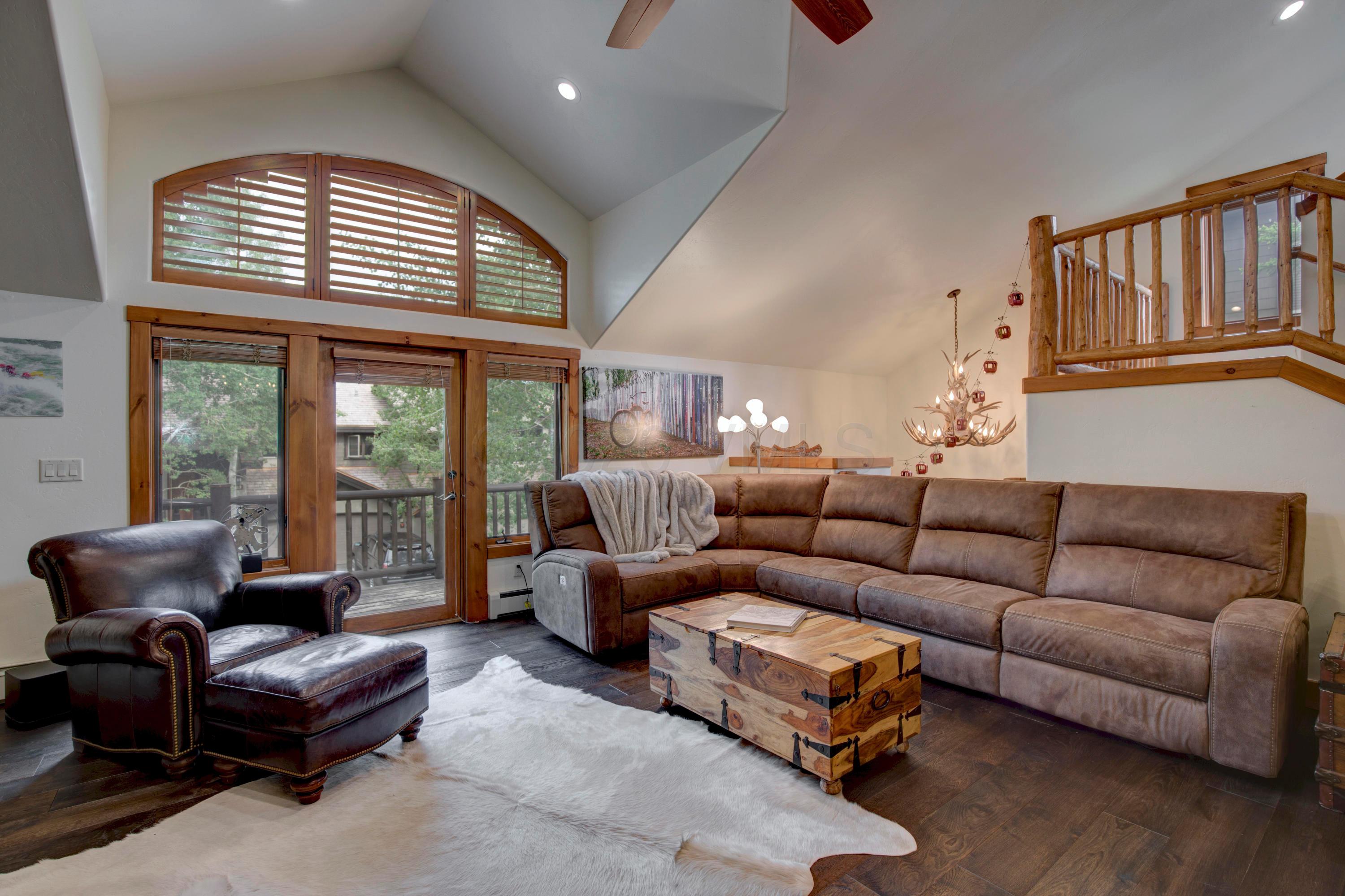 92 Knudson Ranch Road Edwards, CO 81632 - Photo 3 of 26 a living room with furniture ceiling fan and a window