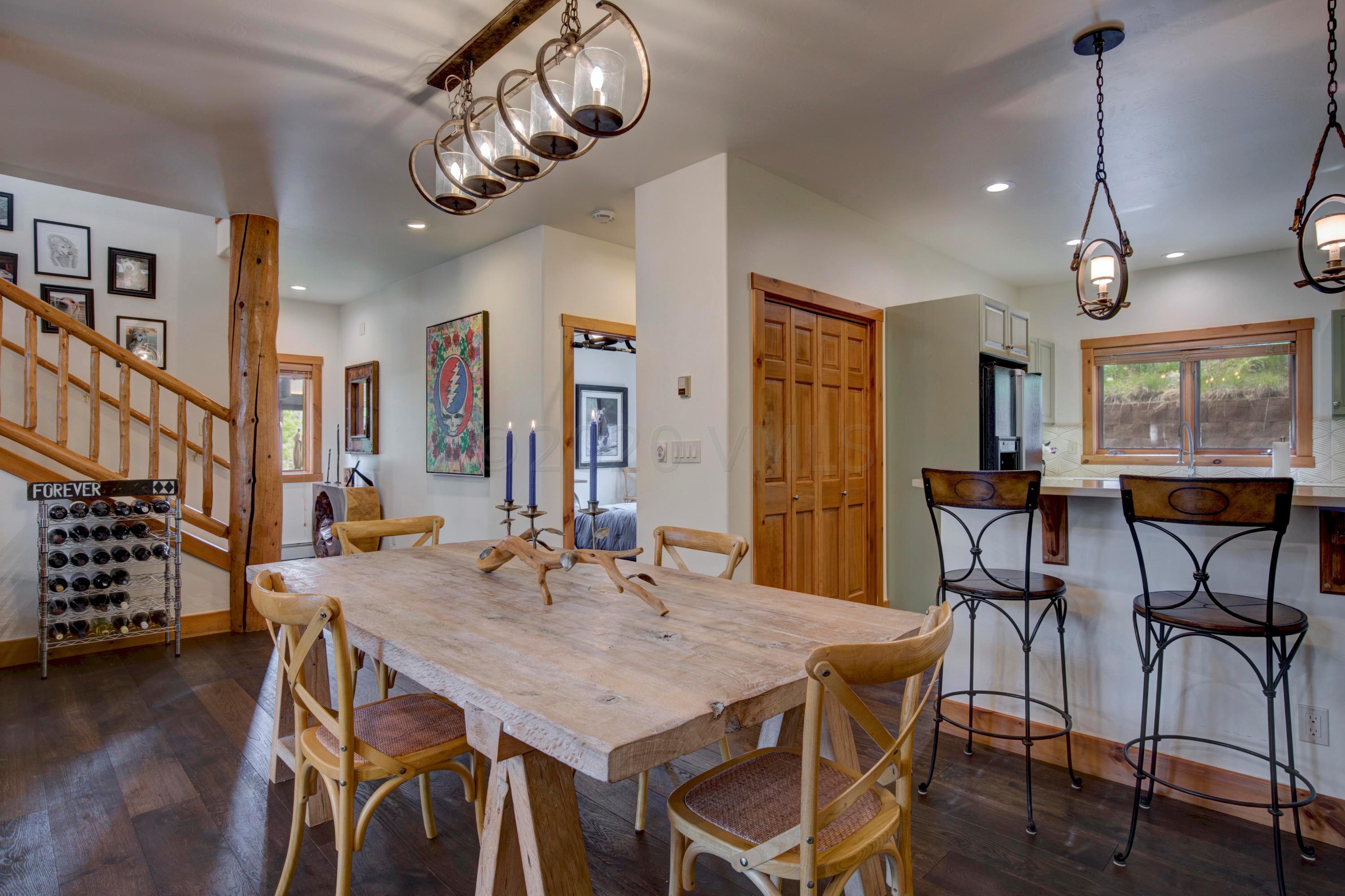 92 Knudson Ranch Road Edwards, CO 81632 - Photo 7 of 26 a view of a dining room with furniture window and wooden floor