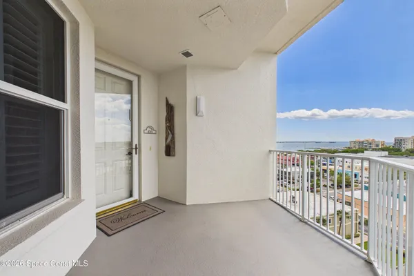 a room with a window and a wooden floor