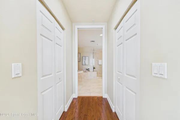 a bathroom with a granite countertop sink a toilet and a large mirror