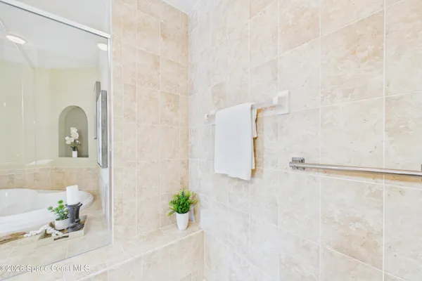 a kitchen with a sink cabinets and wooden floor