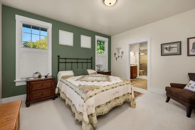 a bedroom with a bed and a table in it