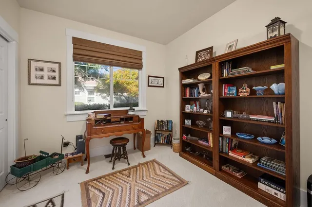 a view of a workspace with furniture and toys