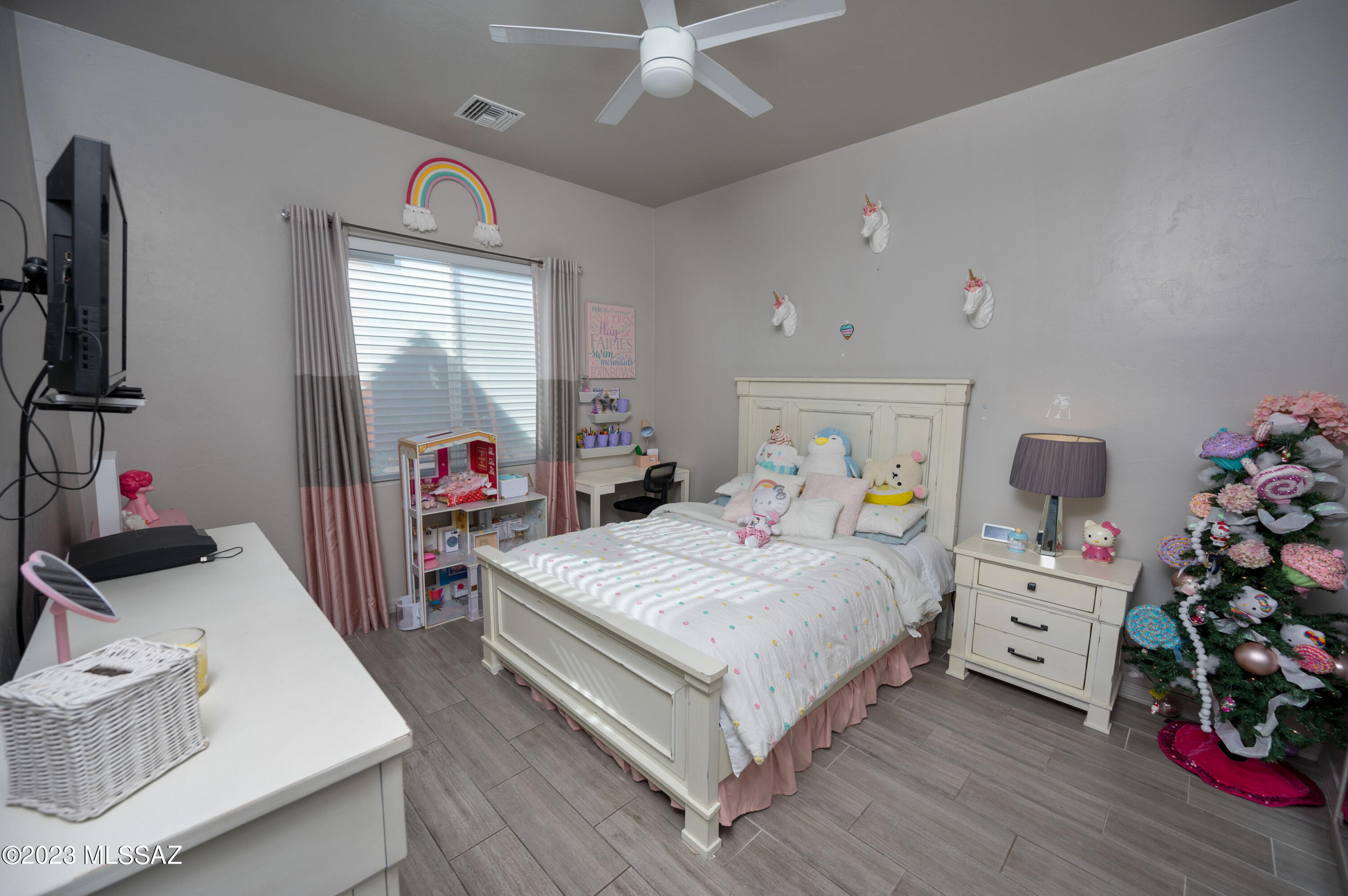 384 Via Estrella Vista Rio Rico, AZ 85648 - Photo 13 of 32 a bed room with a bed and a couch