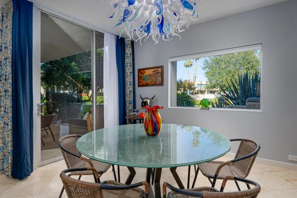 a view of a dining room with furniture window and outside view