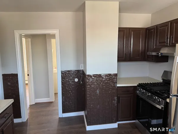 a kitchen with a refrigerator and a stove