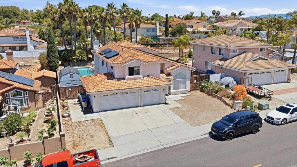 2077 Westwood Road Vista, CA 92083 - Photo 2 of 37 an aerial view of a house with parking space and city view