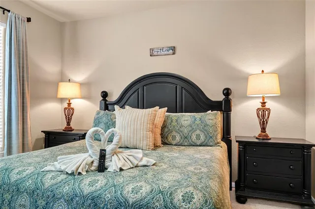 a bathroom with a double vanity sink a mirror and a bathtub