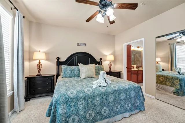 a view of a kitchen with a refrigerator and a sink