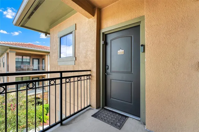 a view of a balcony from a corridor