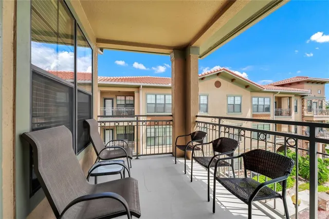 a living room with fireplace furniture and a potted plant