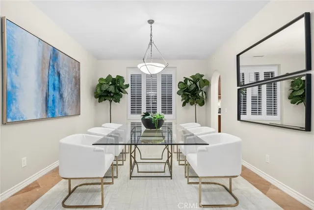 a bathroom with a granite countertop toilet a sink and a mirror