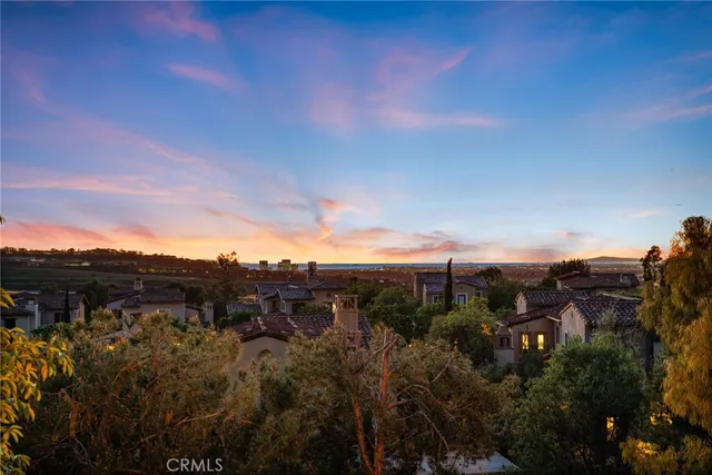 a front view of a house with a garden and garage