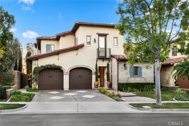 a living room with furniture kitchen view and a large window