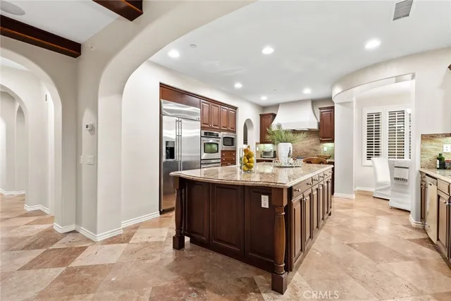 a view of a swimming pool with a table and chairs