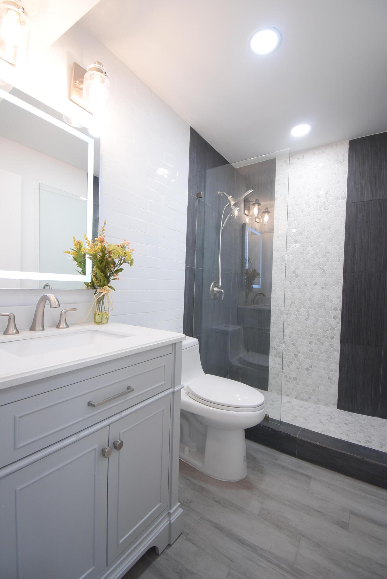 5047 Heatherhill Lane, Unit 60 Boca Raton, FL 33486 - Photo 13 of 34 a bathroom with a sink and a mirror