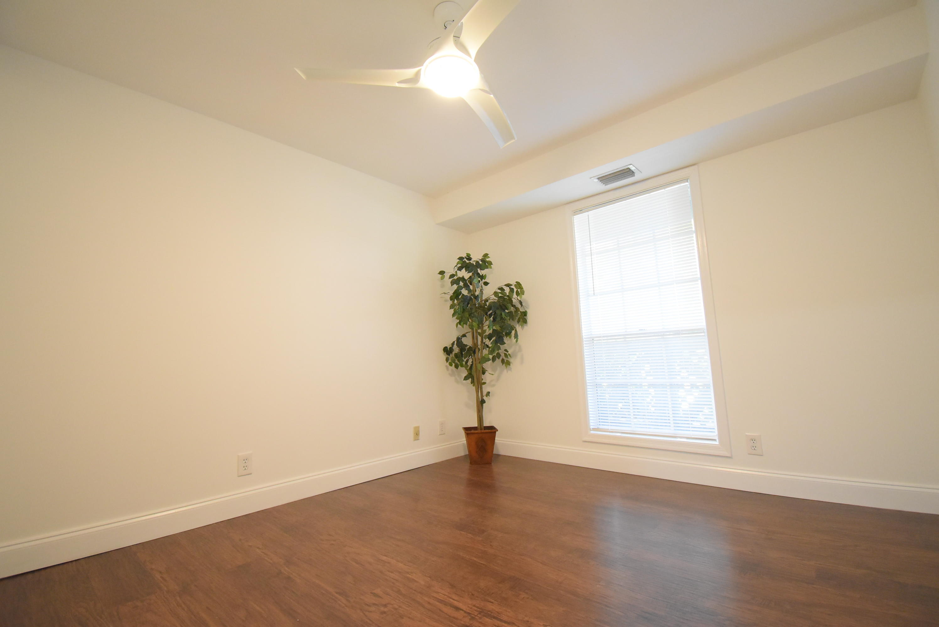 5047 Heatherhill Lane, Unit 60 Boca Raton, FL 33486 - Photo 16 of 34 an empty room with a window and a ceiling fan