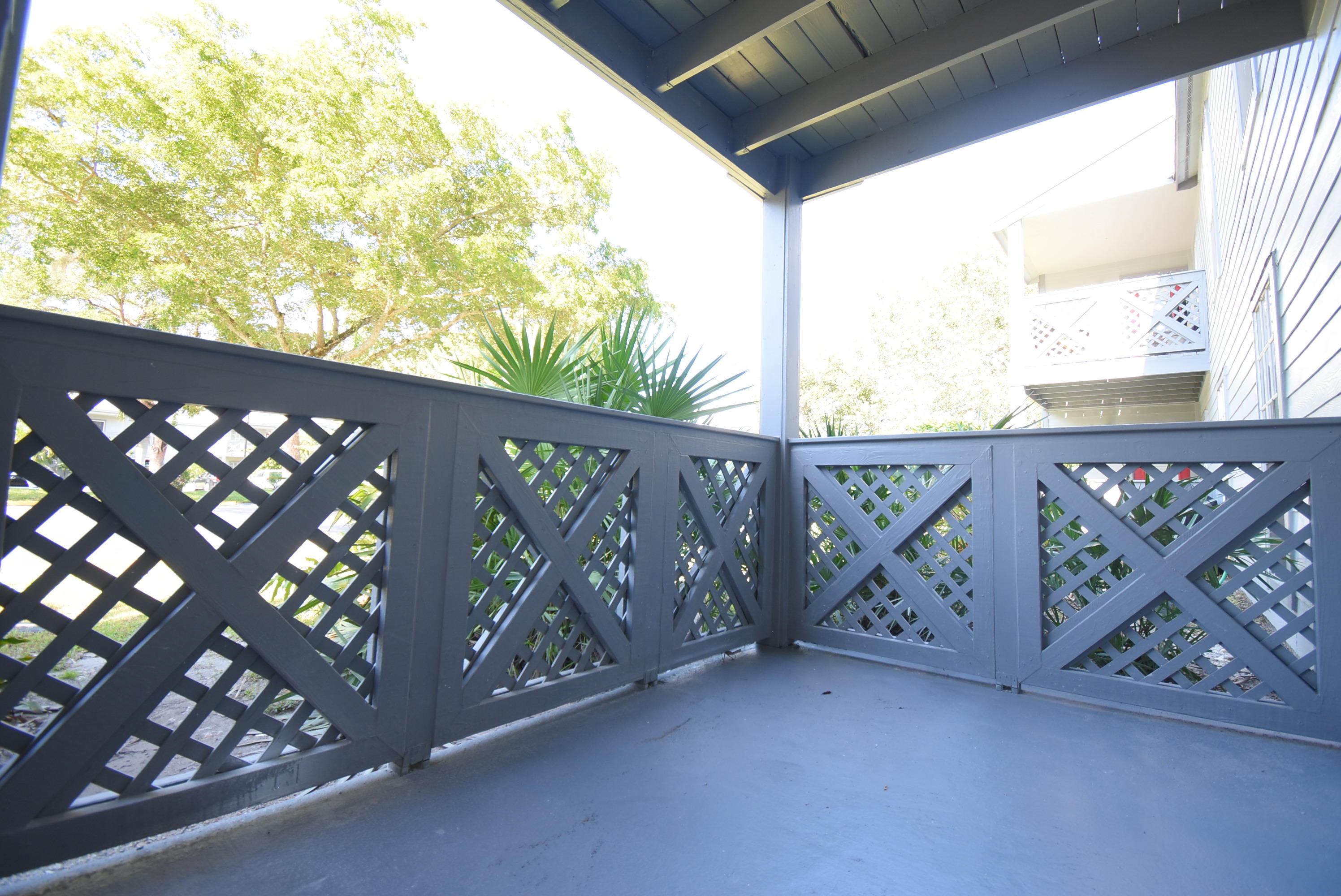 5047 Heatherhill Lane, Unit 60 Boca Raton, FL 33486 - Photo 19 of 34 a view of a street with wooden stairs