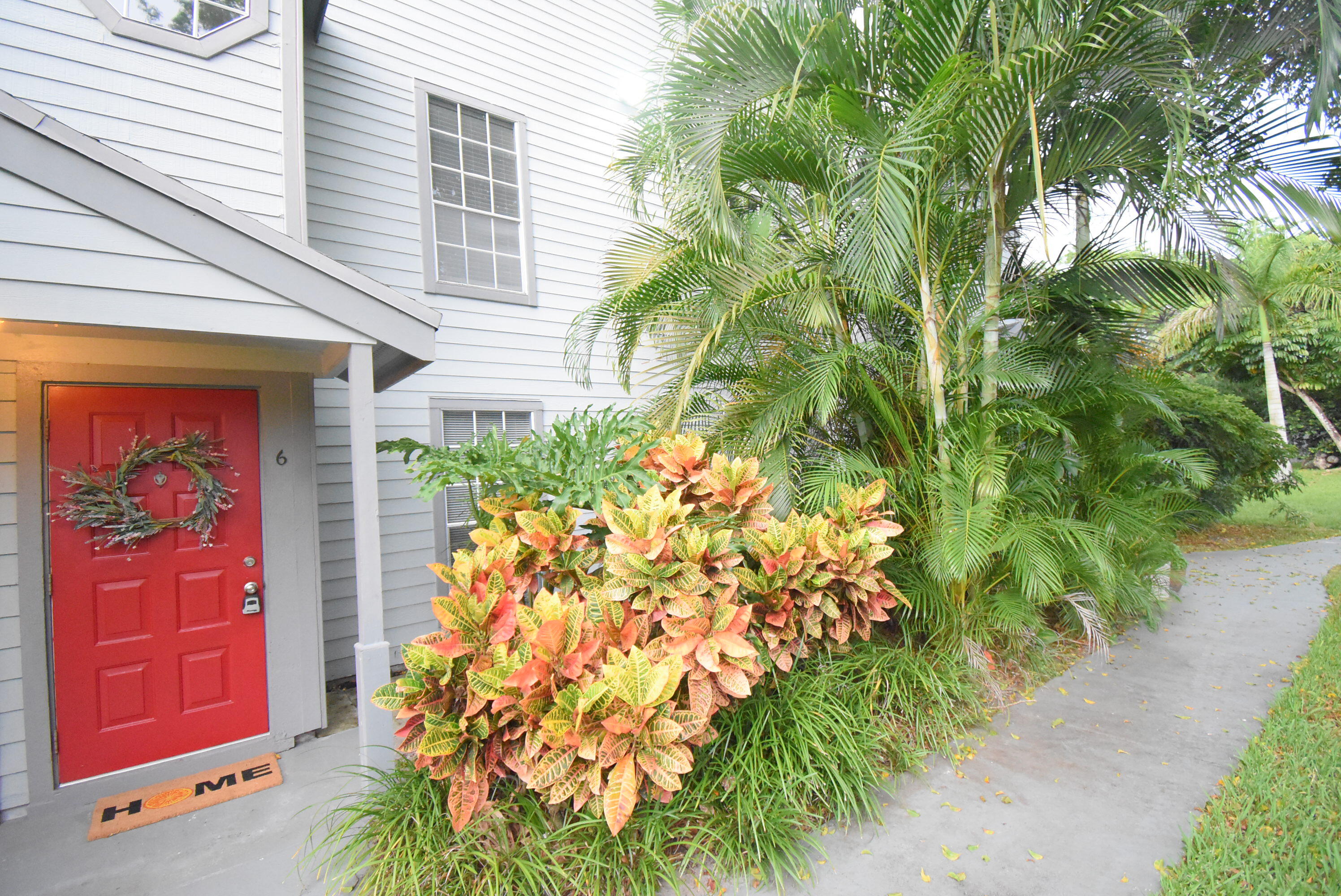 5047 Heatherhill Lane, Unit 60 Boca Raton, FL 33486 - Photo 21 of 34 a plant that is in front of a house