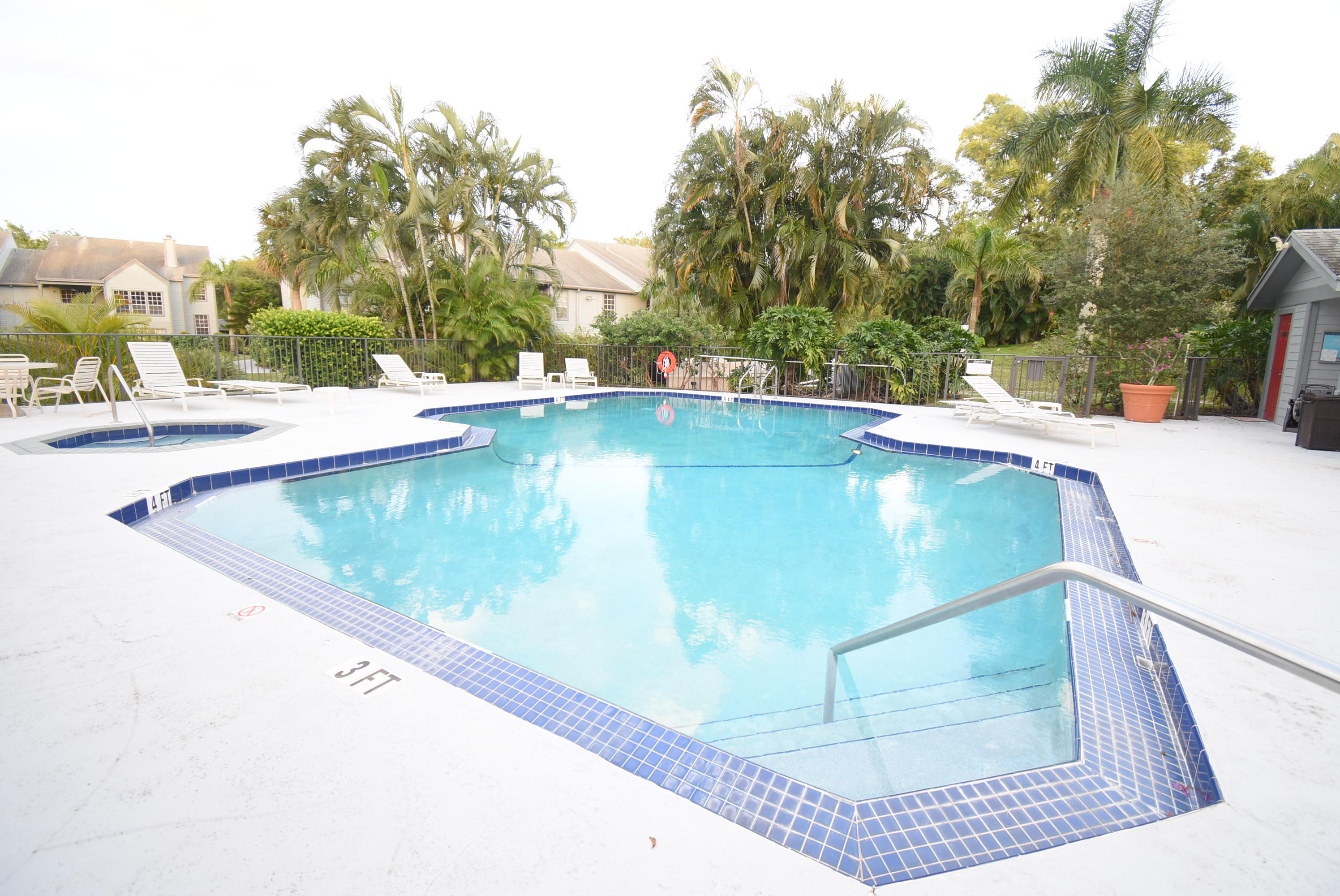 5047 Heatherhill Lane, Unit 60 Boca Raton, FL 33486 - Photo 25 of 34 a view of a swimming pool with a patio