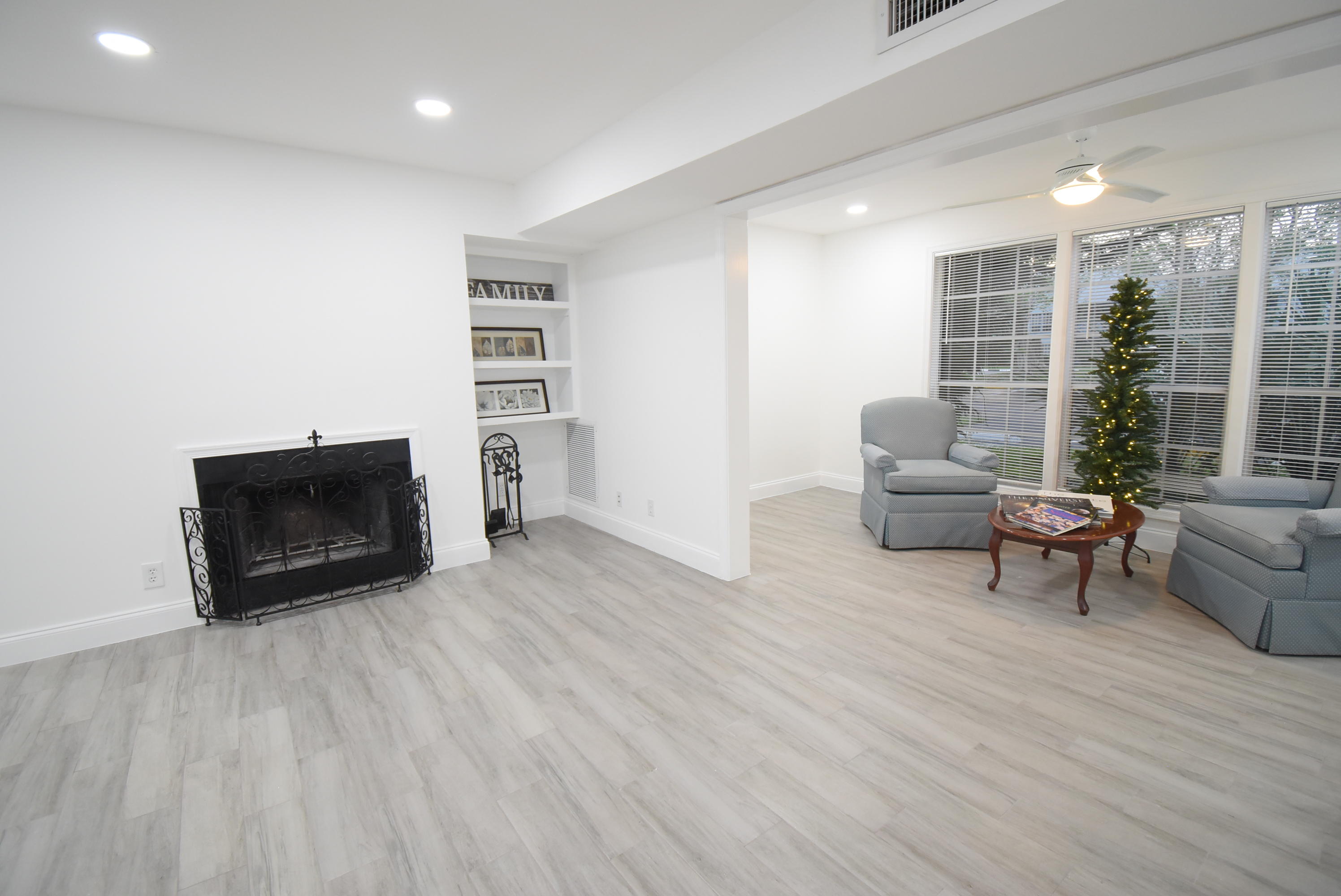 5047 Heatherhill Lane, Unit 60 Boca Raton, FL 33486 - Photo 3 of 34 a living room with furniture and a fireplace