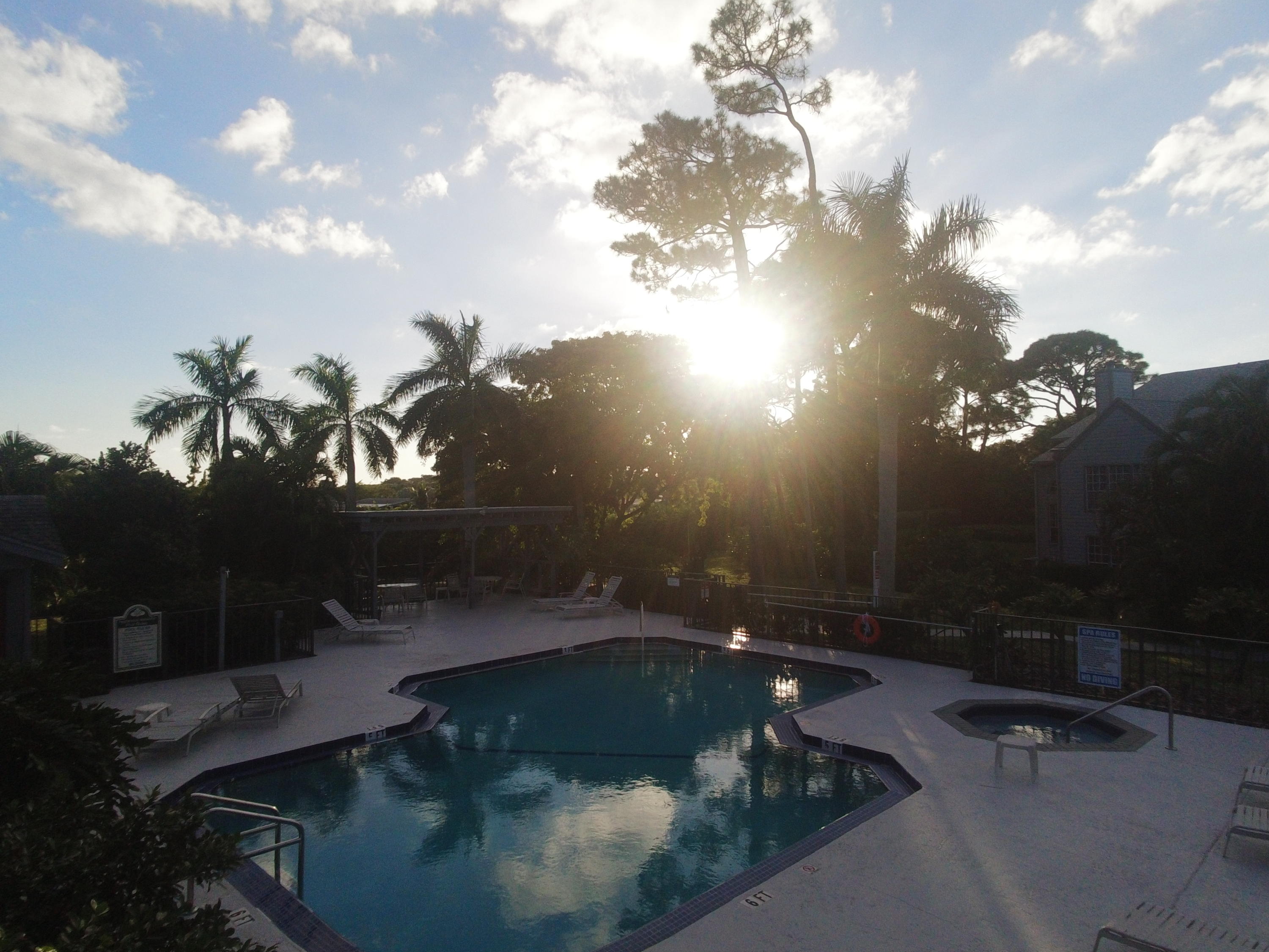 5047 Heatherhill Lane, Unit 60 Boca Raton, FL 33486 - Photo 31 of 34 a view of swimming pool from a yard