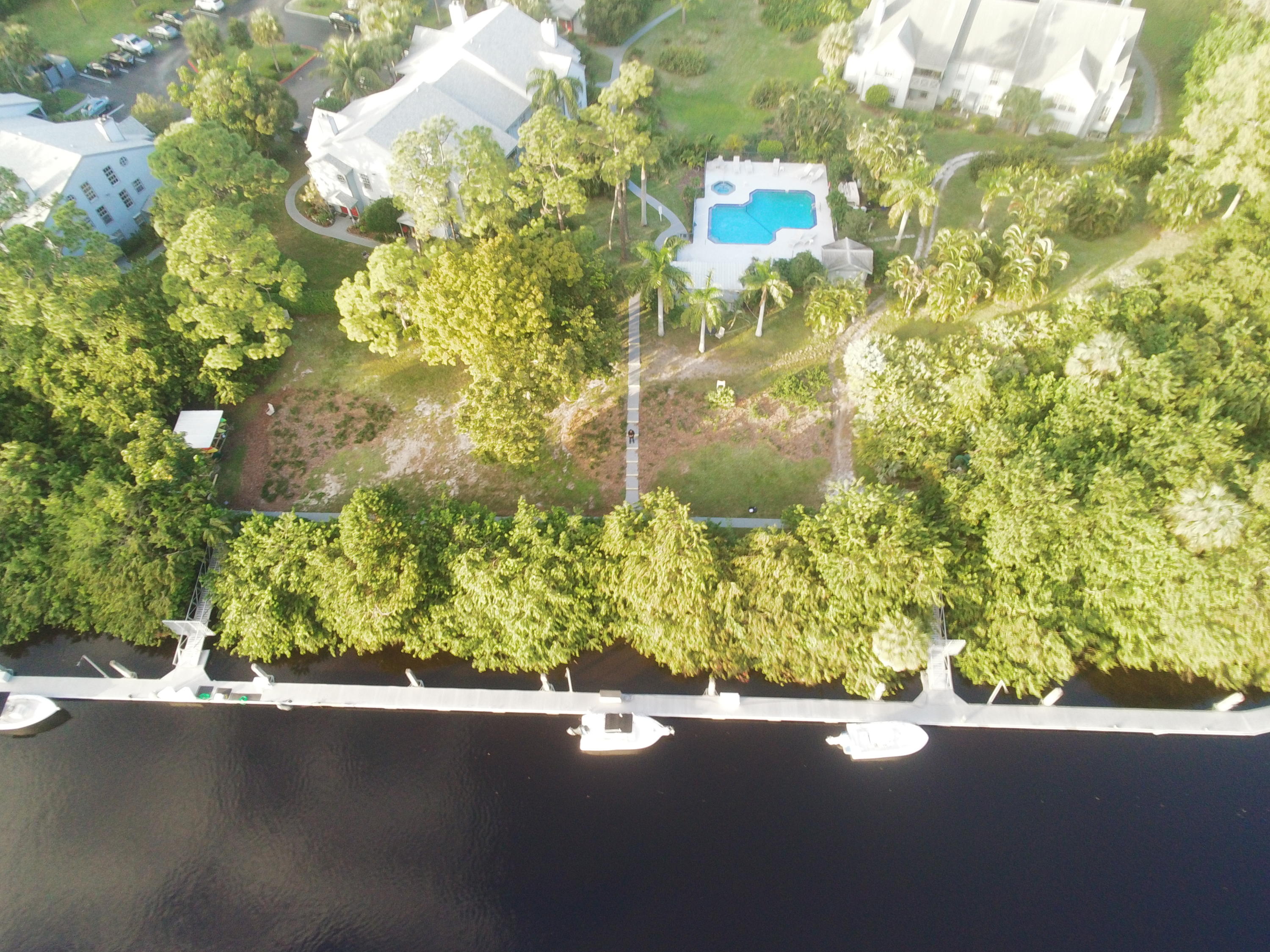 5047 Heatherhill Lane, Unit 60 Boca Raton, FL 33486 - Photo 33 of 34 a picture of a tree in front of a house