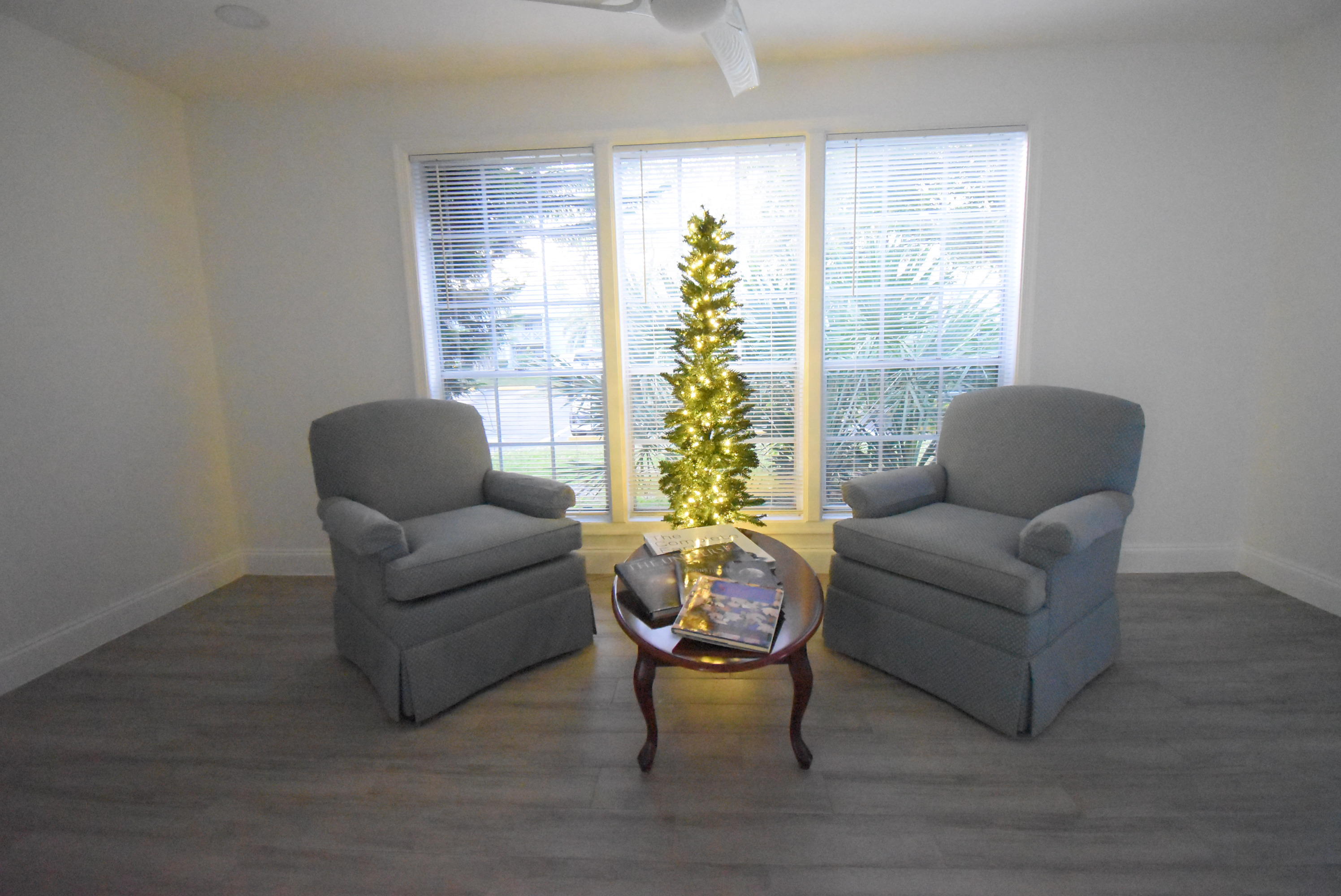 5047 Heatherhill Lane, Unit 60 Boca Raton, FL 33486 - Photo 8 of 34 a living room with furniture and a large window