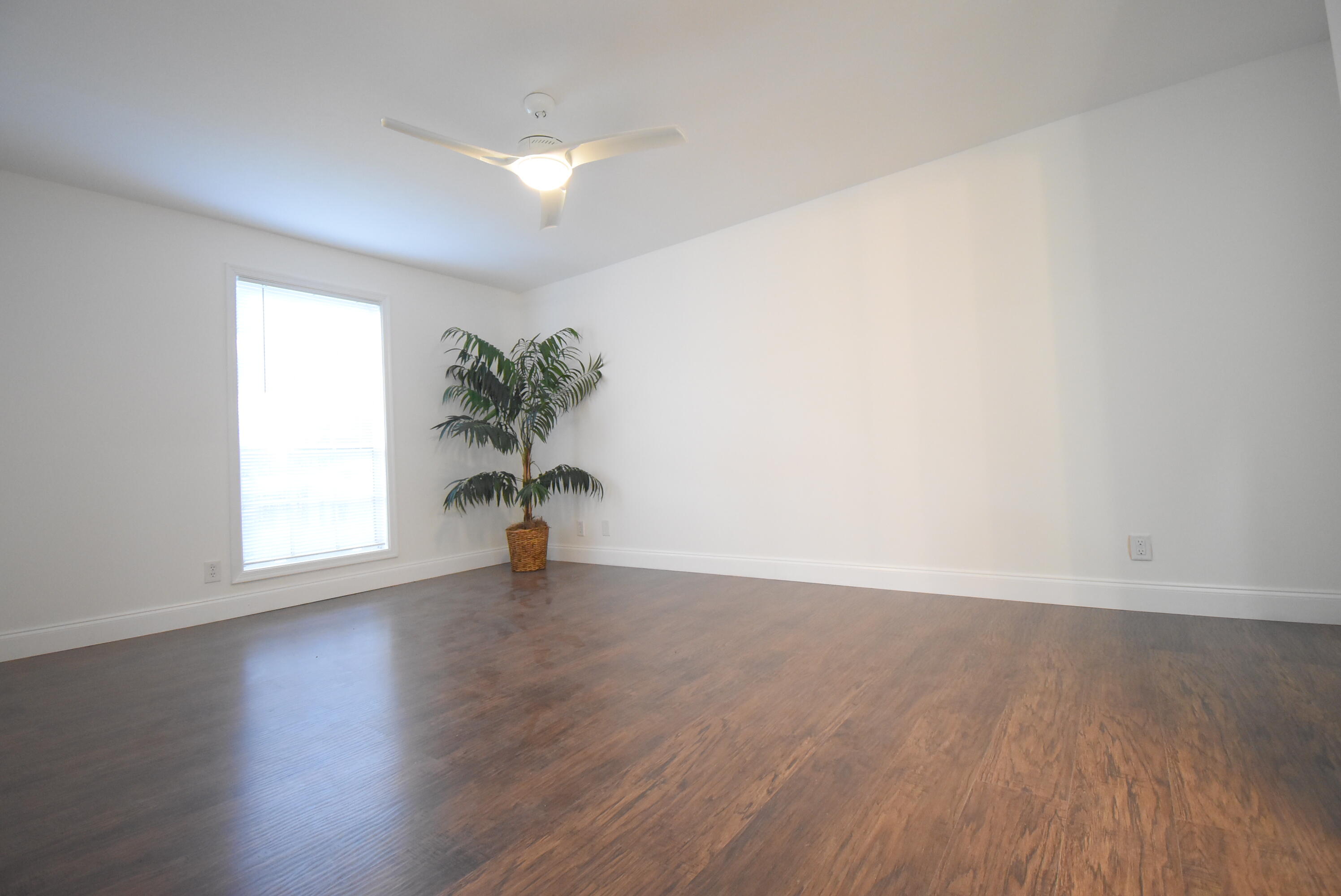 5047 Heatherhill Lane, Unit 60 Boca Raton, FL 33486 - Photo 9 of 34 a view of a room with wooden floor and a window