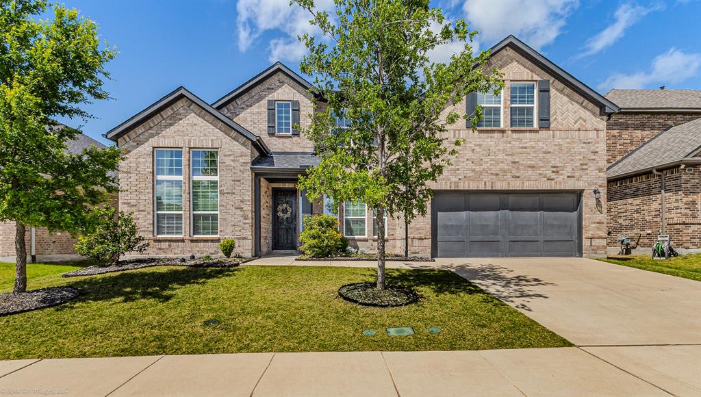 904 Vineyard Way Forney, TX 75126 - Photo 1 of 38 a front view of a house with a yard and garage