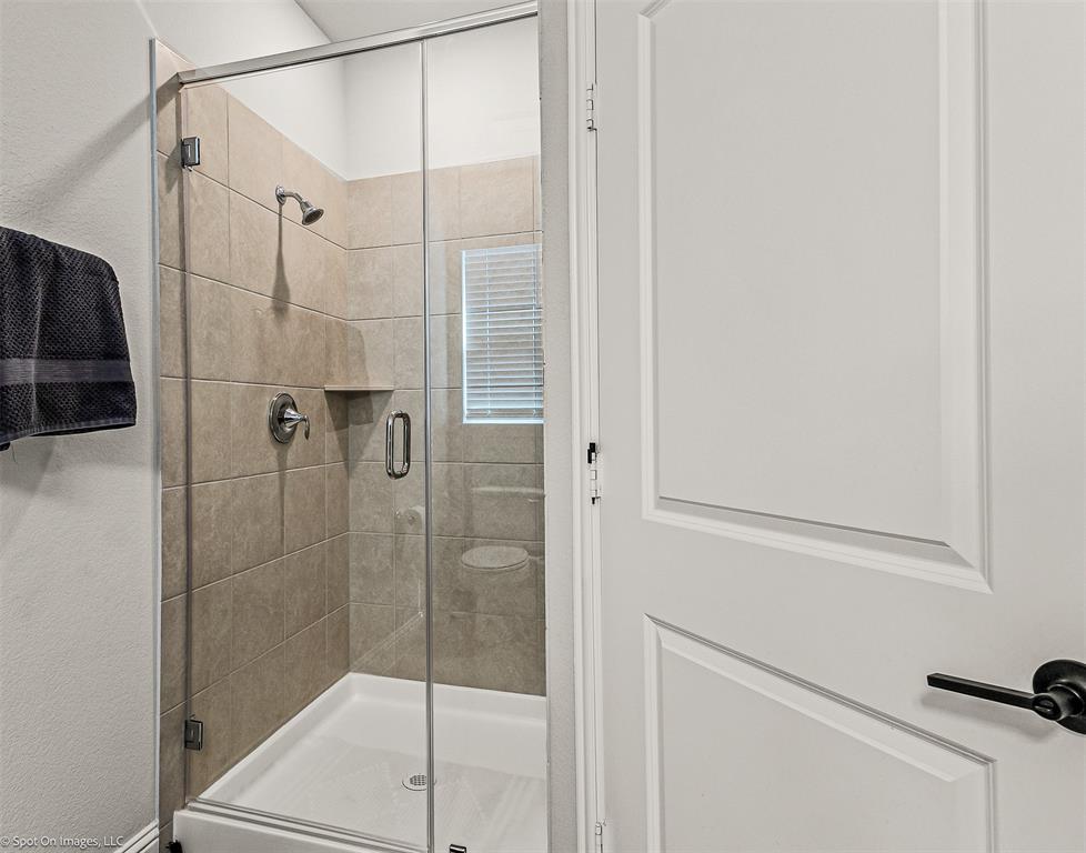 904 Vineyard Way Forney, TX 75126 - Photo 19 of 38 a bathroom with a shower