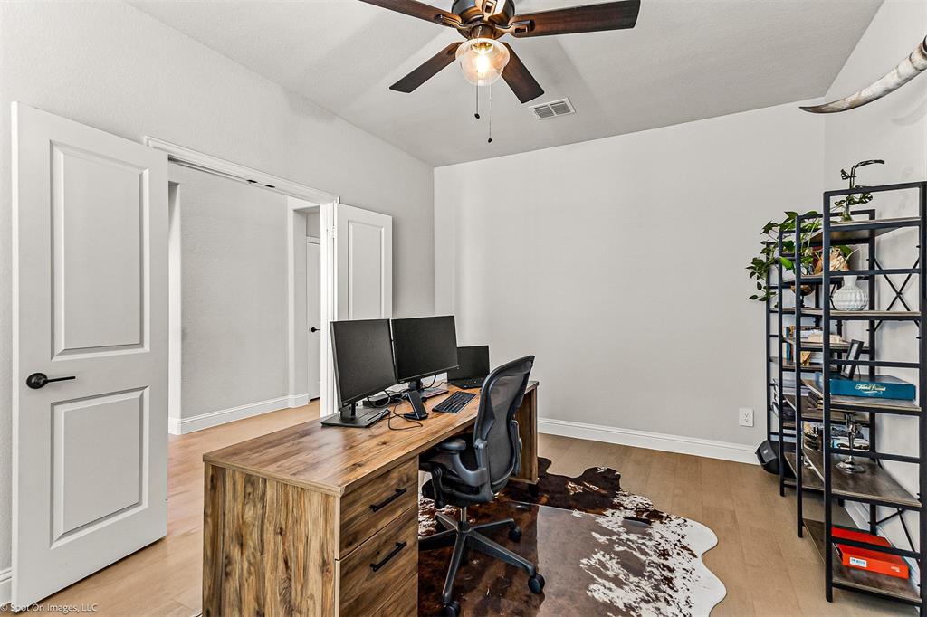 904 Vineyard Way Forney, TX 75126 - Photo 21 of 38 a workspace with furniture and wooden floor