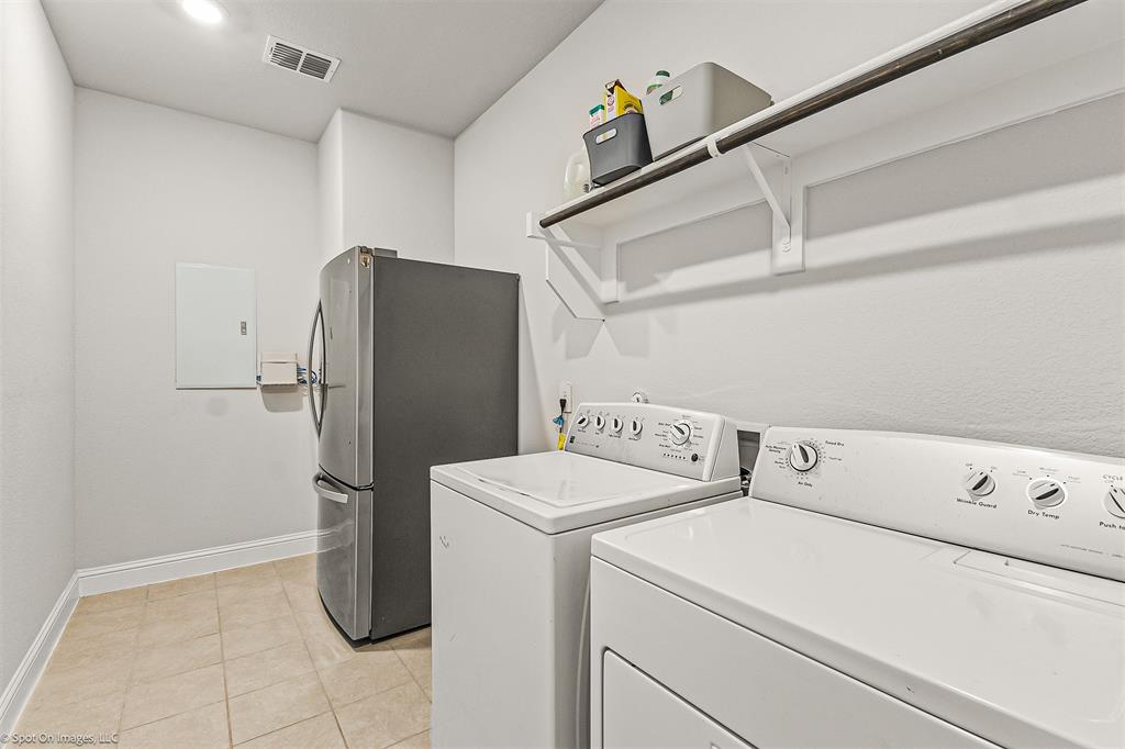 904 Vineyard Way Forney, TX 75126 - Photo 23 of 38 a utility room with dryer and washer