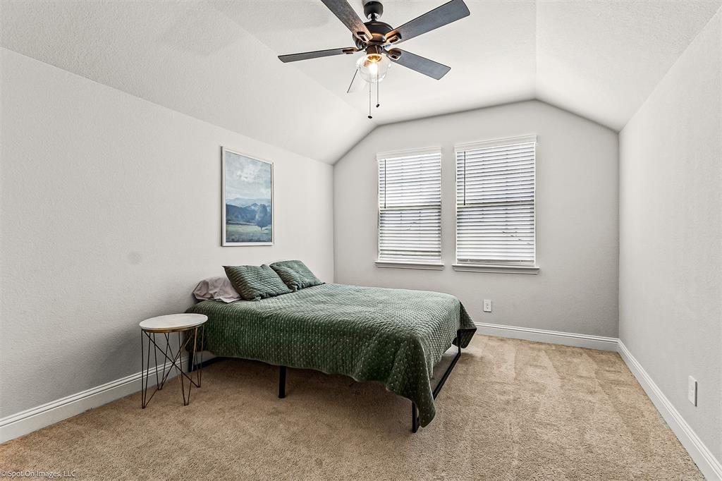 904 Vineyard Way Forney, TX 75126 - Photo 29 of 38 a bedroom with a bed and window