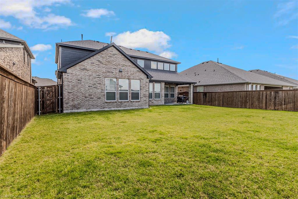 904 Vineyard Way Forney, TX 75126 - Photo 38 of 38 a view of a house with a garden and yard