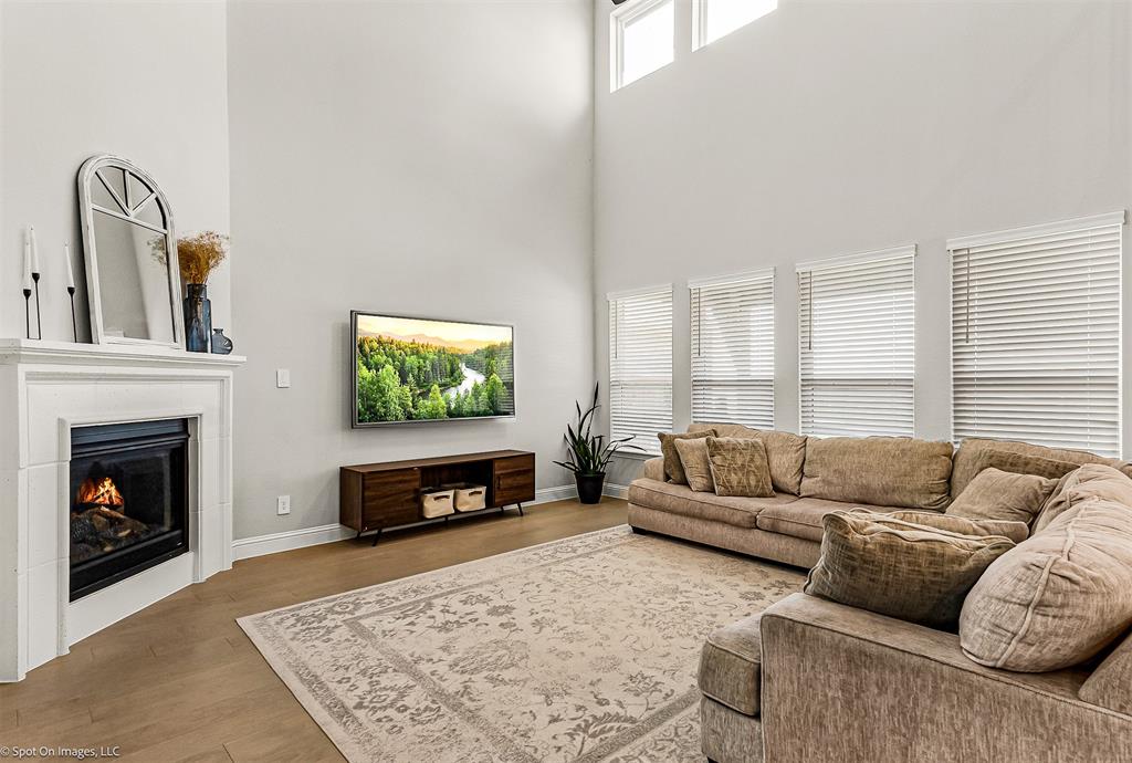 904 Vineyard Way Forney, TX 75126 - Photo 7 of 38 a living room with furniture and a fireplace