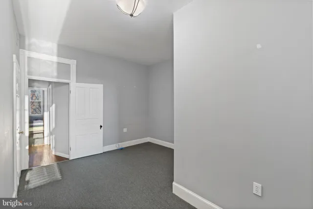 an empty room with windows