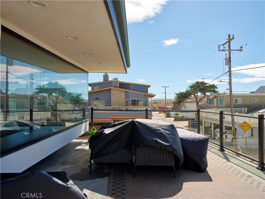 311 Juanita Avenue Oceano, CA 93445 - Photo 11 of 27 a roof deck with table and chairs