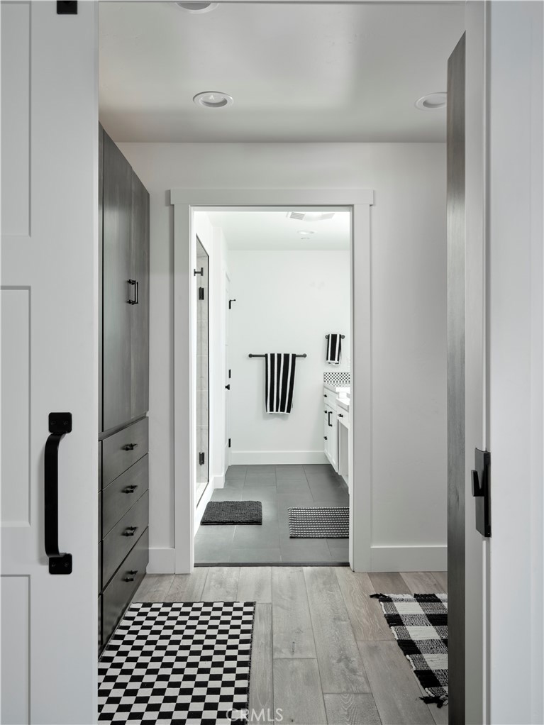 311 Juanita Avenue Oceano, CA 93445 - Photo 12 of 27 a view of a hallway with wooden floor and a living room