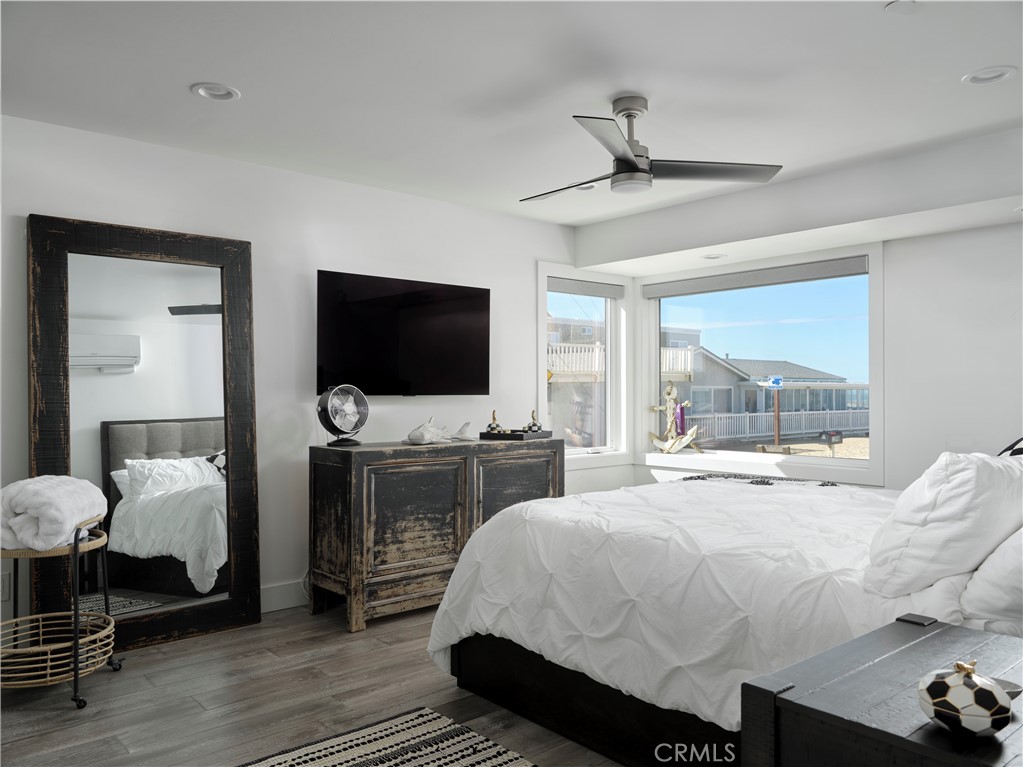 311 Juanita Avenue Oceano, CA 93445 - Photo 13 of 27 a bedroom with a bed and a flat tv screen on dresser