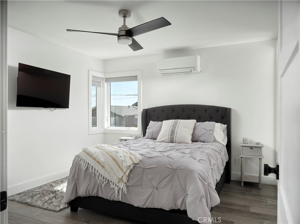 311 Juanita Avenue Oceano, CA 93445 - Photo 17 of 27 a bedroom with a bed tv and a window