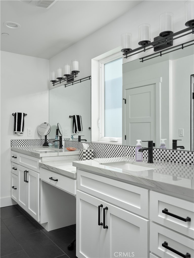 311 Juanita Avenue Oceano, CA 93445 - Photo 19 of 27 a bathroom with a sink and a mirror