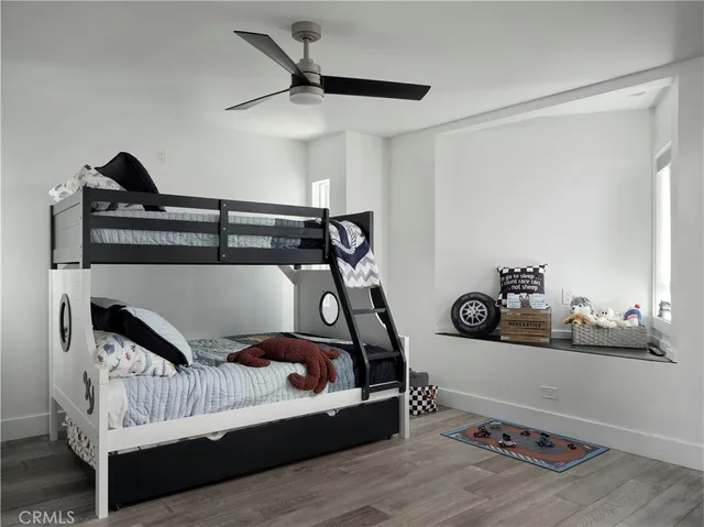 a living room with a mirror and a glass door shower