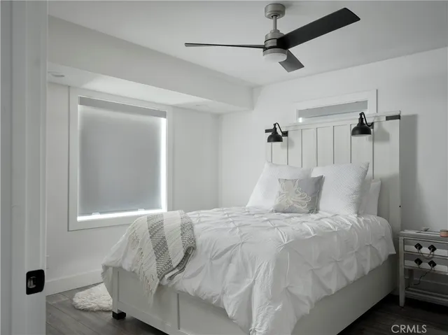 a room with water heater and stainless steel appliances