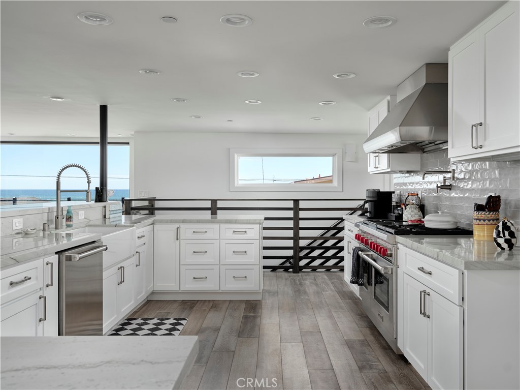 311 Juanita Avenue Oceano, CA 93445 - Photo 3 of 27 a kitchen with granite countertop a sink and cabinets