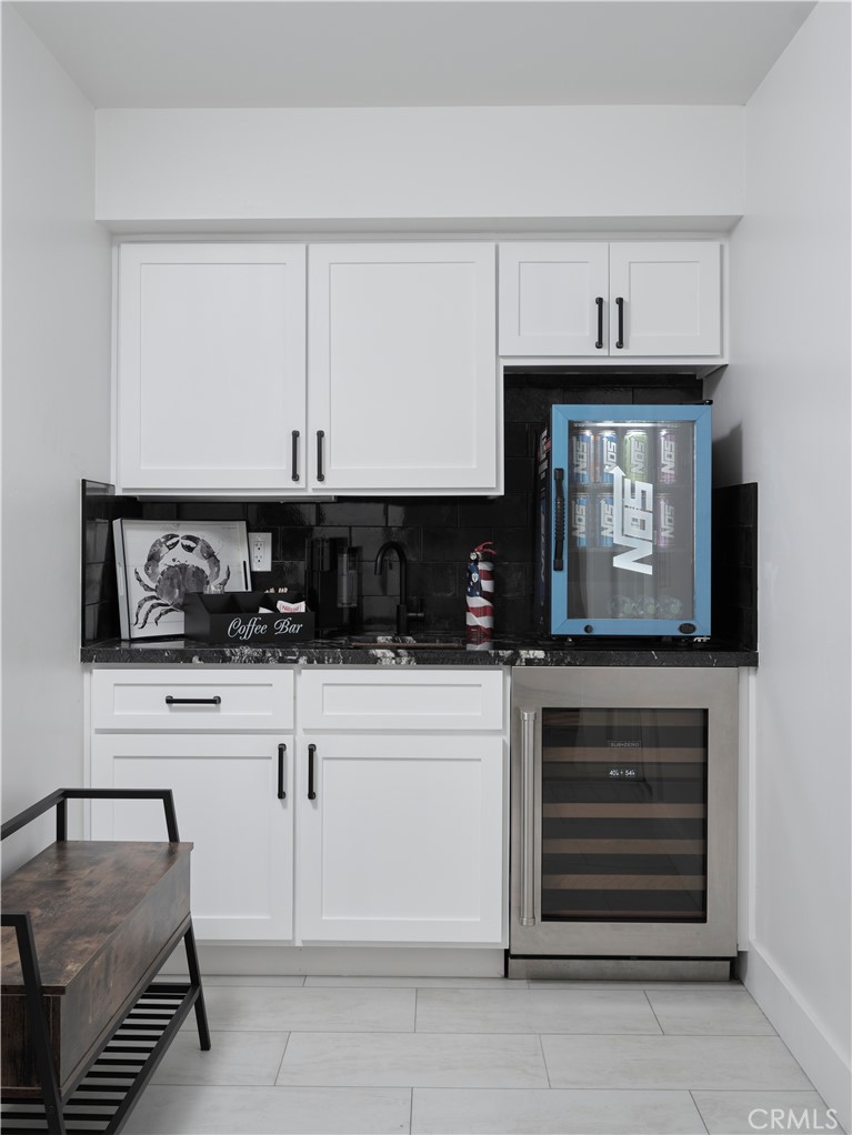 311 Juanita Avenue Oceano, CA 93445 - Photo 6 of 27 a kitchen with granite countertop white cabinets and stainless steel appliances