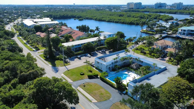 an aerial view of house with yard swimming pool and outdoor seating