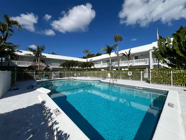 a view of a swimming pool with a patio