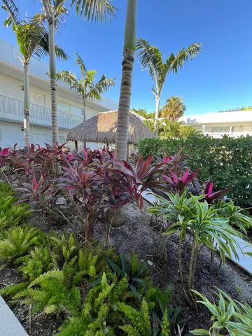 a view of a chair and tables in the patio