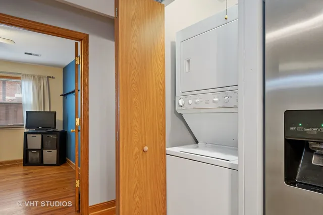 a view of storage and utility room with washer and dryer